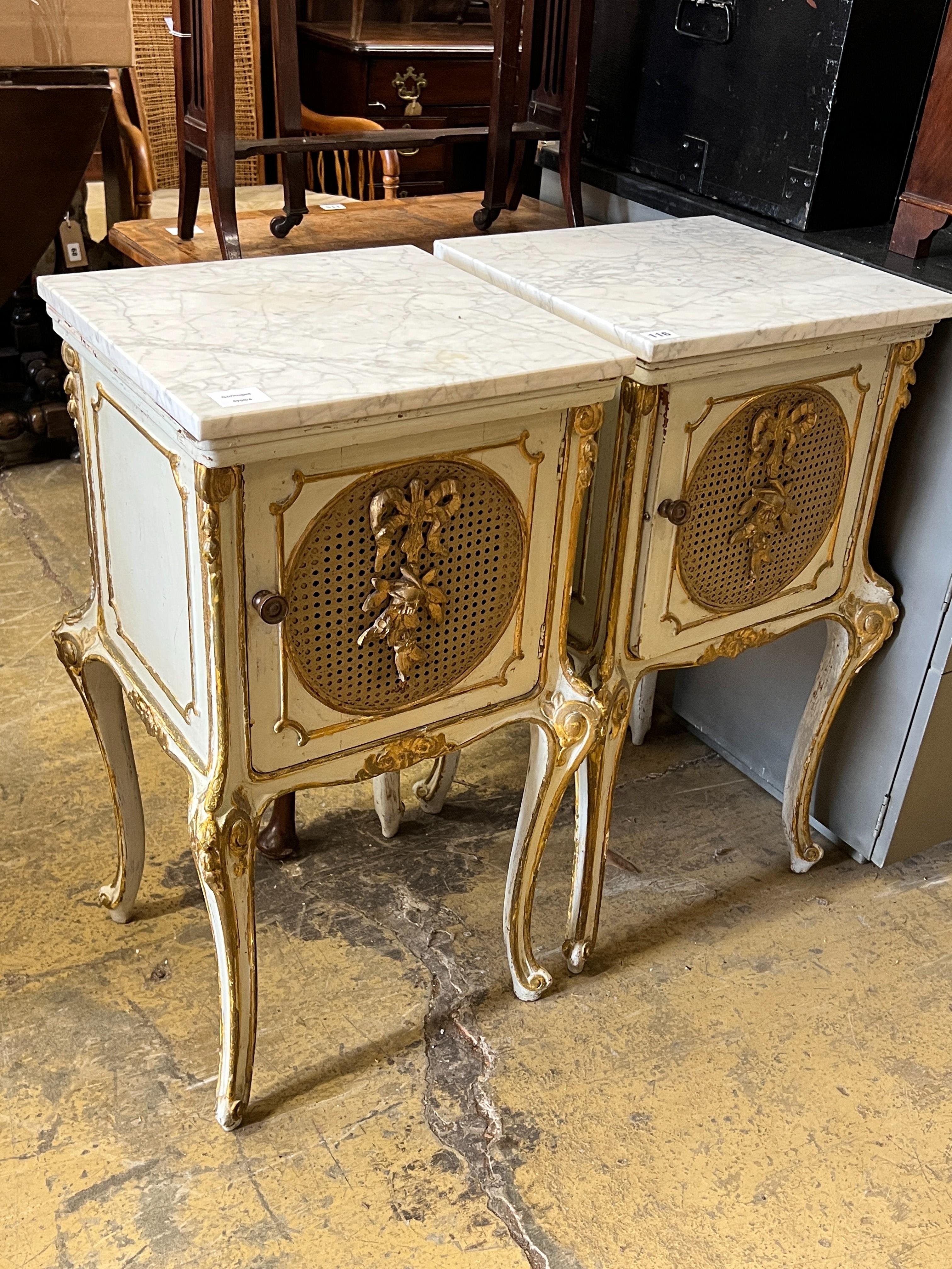 A pair of French caned parcel gilt marbled topped bedside cabinets, width 44cm, depth 41cm, height 78cm